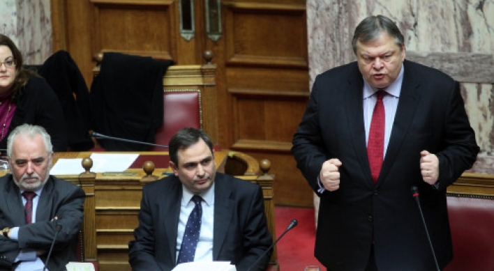 Greece approves more budget cuts for bailout