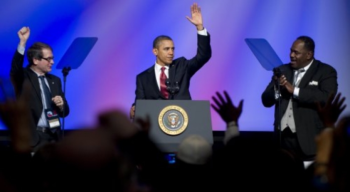 Punchy Obama hits Republicans over auto bailout