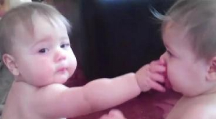 Twin sisters’ squabble over single pacifier becomes huge hit online