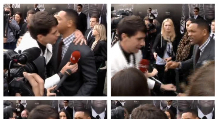 Will Smith slaps journalist who tries to kiss him