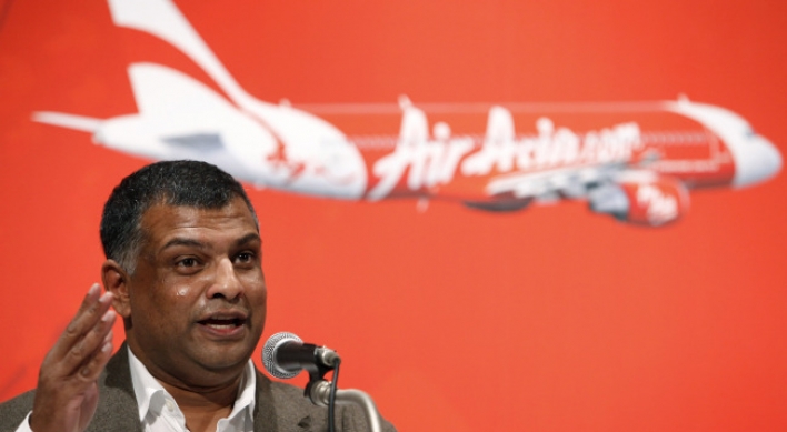 AirAsia parlays planes into phones, hotels