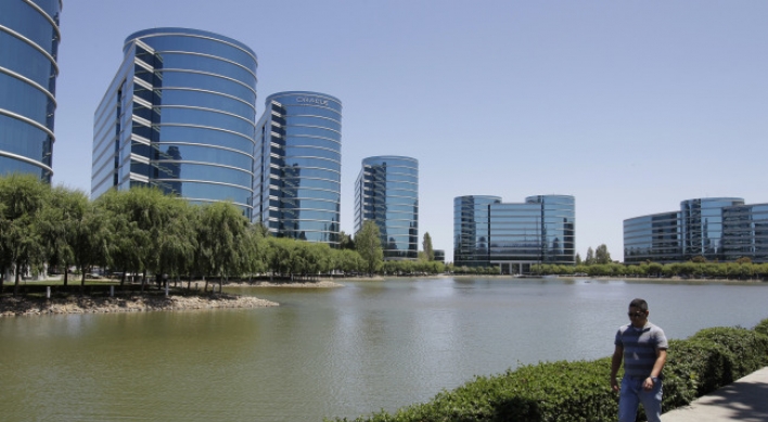 Oracle’s quarterly earnings up 8 percent, exceeding analyst views