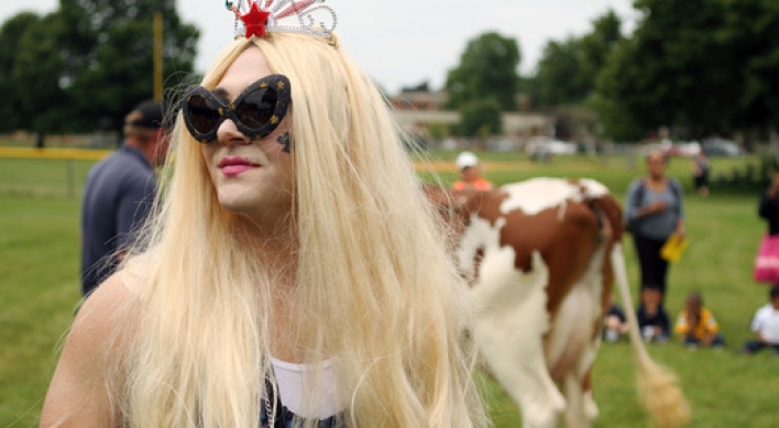 Principal dresses as Lady Gaga, milks cow for bet
