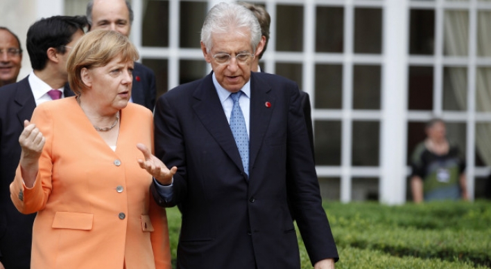 Merkel, Monti vow to protect eurozone