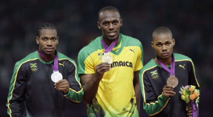 Bolt wins 200, Rudisha gets 800 record at Olympics