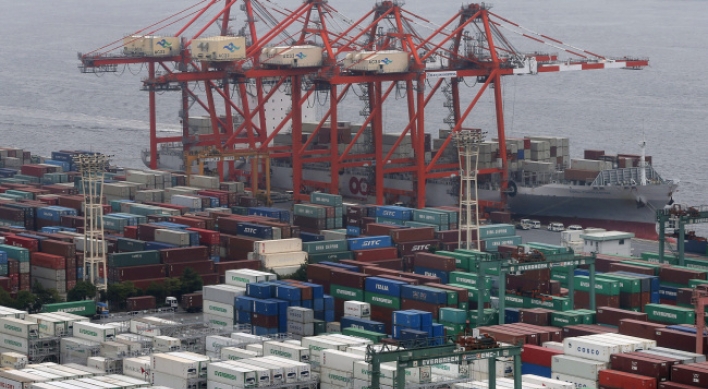 Japan swings to trade deficit as exports sink