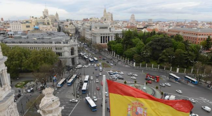 S&P cuts Spain rating to near junk