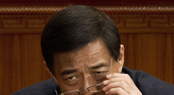 China expels Bo from legislature, set for trial