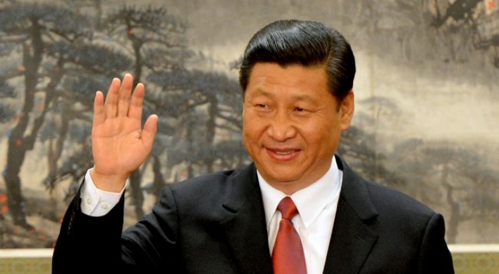 Xi takes helm amid reform calls