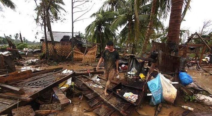 Powerful typhoon kills at least 74 in Philippines