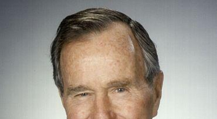 Ex-U.S. President H.W. Bush remains  hospitalized, stable