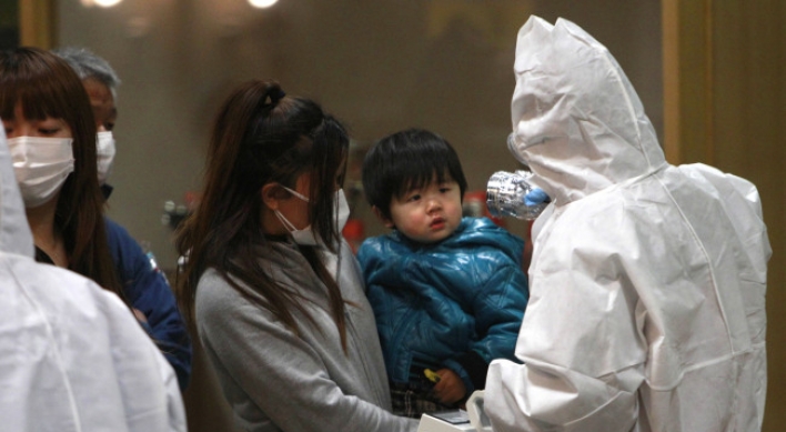 Japanese flee Fukushima to faraway Okinawa