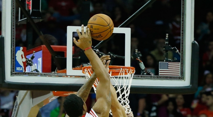 Harden, Asik lead Rockets past Nets