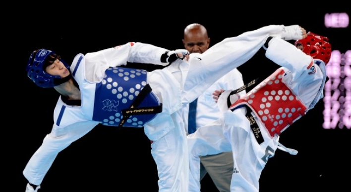 Olympics drops wrestling, keeps taekwondo