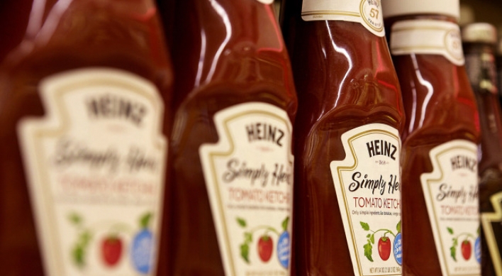 Buffett buys Heinz for $23 billion