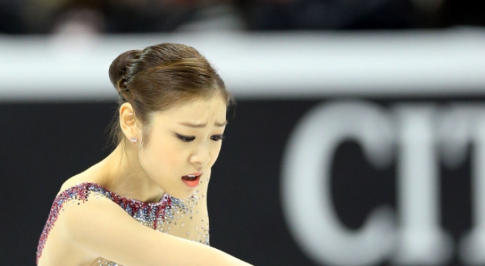 Kim Yu-na leads after short program at world championships