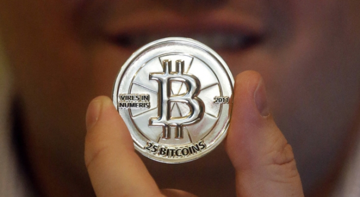 Bitcoin bursts: Hacker currency gets wild ride