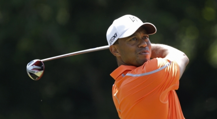Unheralded Castro leads with McIlroy, Woods lurking