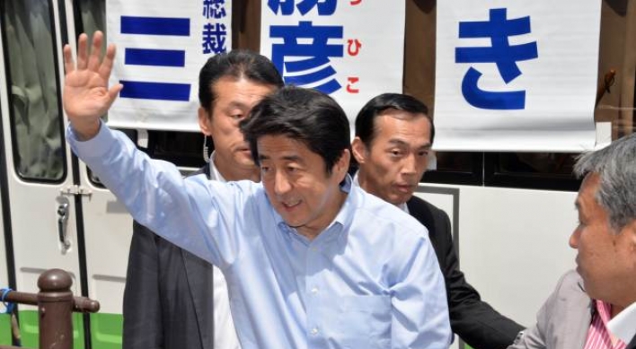 Abe hints at possible delay in tax hike