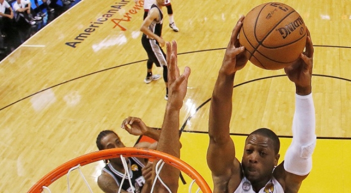 Heat beats Spurs in OT, forcing Game 7