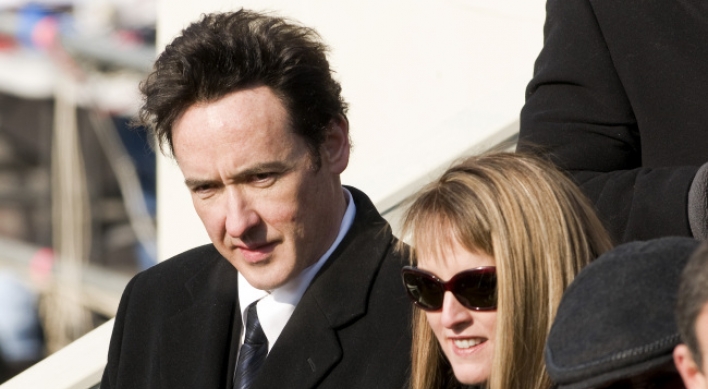 Woman charged with stalking U.S. actor John Cusack