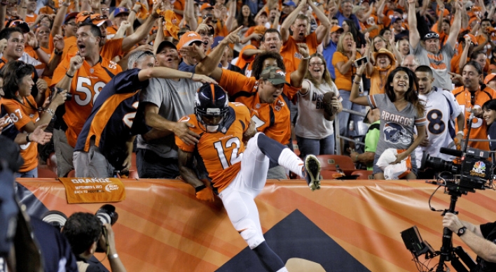 Manning’s 7 TDs lead Broncos past Ravens 49-27