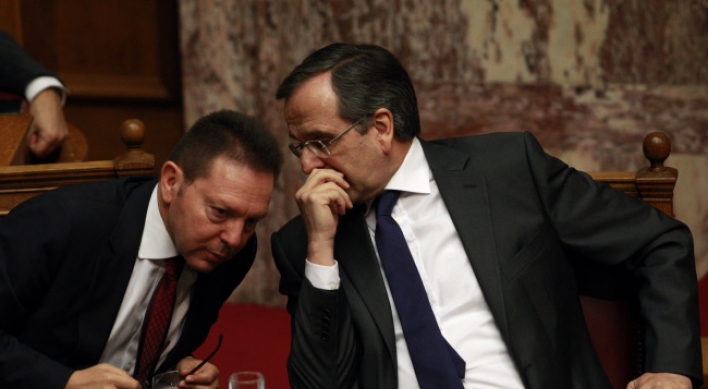 Greece approves tough budget