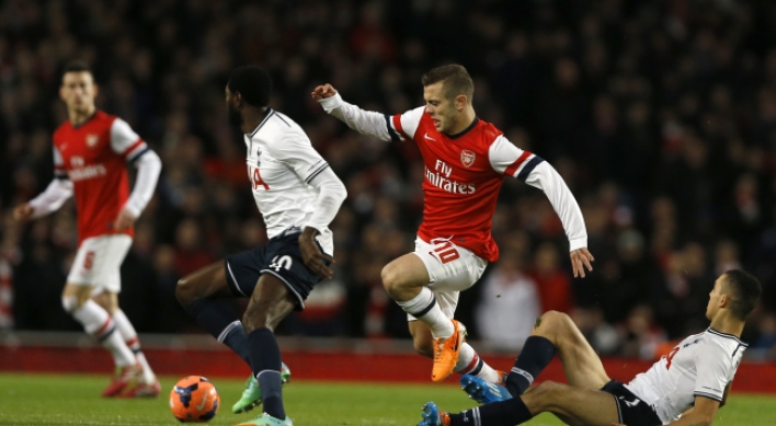 Arsenal sinks Spurs in cup, Blades fell Villa