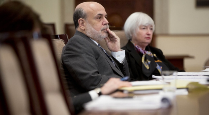 Yellen sworn in as Bernanke joins Brookings