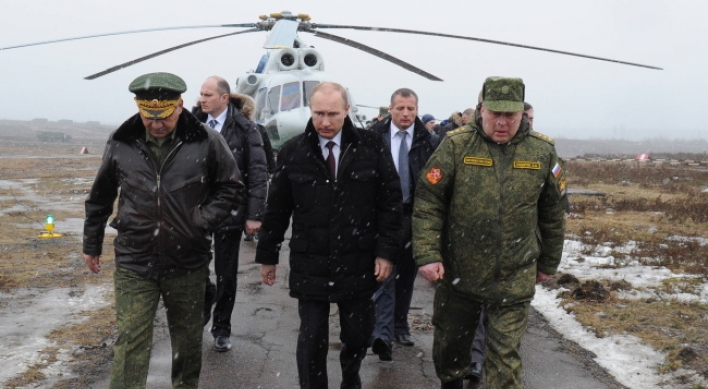 Putin ends military drills, but Crimea tension still high