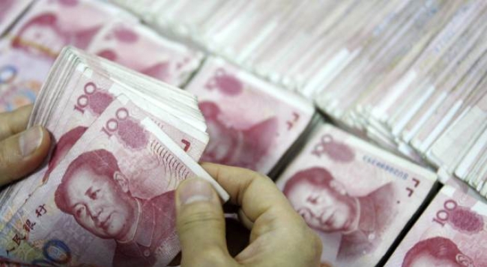 China doubles yuan trading band