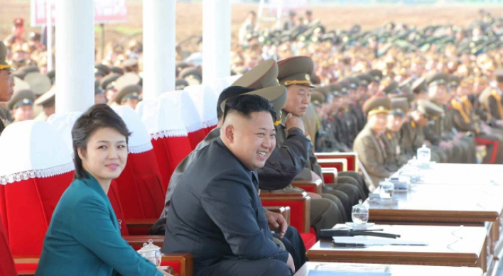 North Korean leader, wife attend air force test event