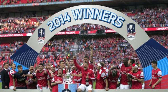 Arsenal ends 9-year title drought