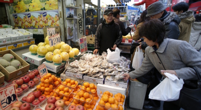 Abe declares end of deflation