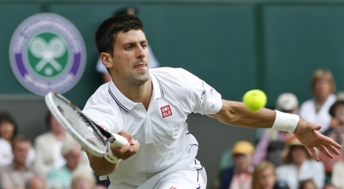 Djokovic survives