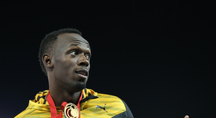 Usain Bolt strikes gold in Glasgow