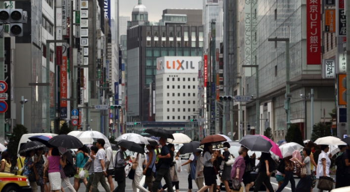 Japan’s economy shrinks on tax hike