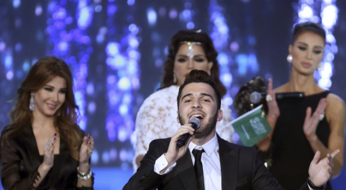 Syrian wins Arab song contest, keeps clear of politics