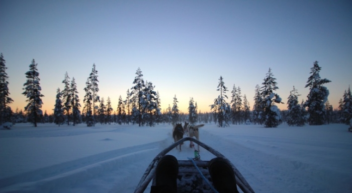 Basking under aurora-canvased winter skies of Finland