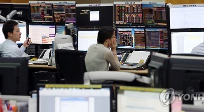 Korean shares close flat as Fed nods to heightened risks