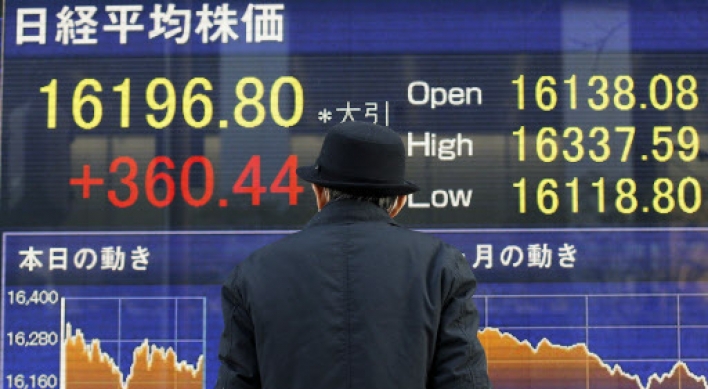 Tokyo stocks fall sharply by break on stronger yen, weaker oil