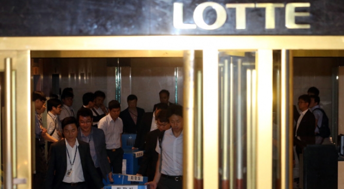 Lotte hires major law firms for defense as probe widens