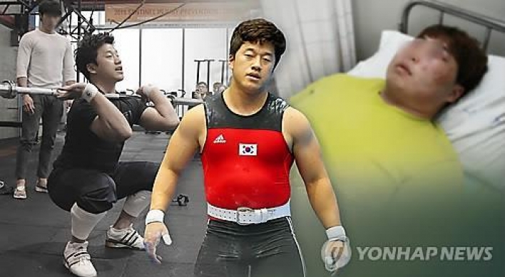 Olympic weightlifting champ ordered to pay fines for assault charges