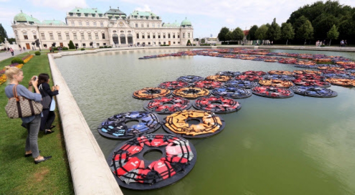 Ai Weiwei’s refugee life jackets in Vienna palace pond