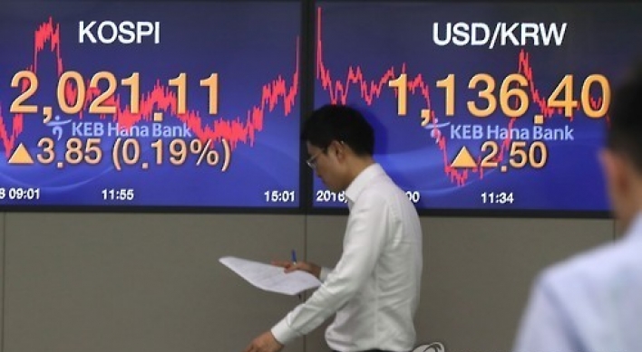 Korean shares down in late morning trading