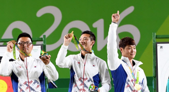 20-something friends team up for 1st Olympic gold in archery