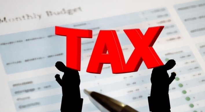 Corporate tax burden falls, rises for personal income: report