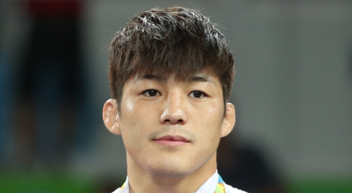 Korean wrestler Kim Hyeon-woo overcomes judging controversy to win bronze