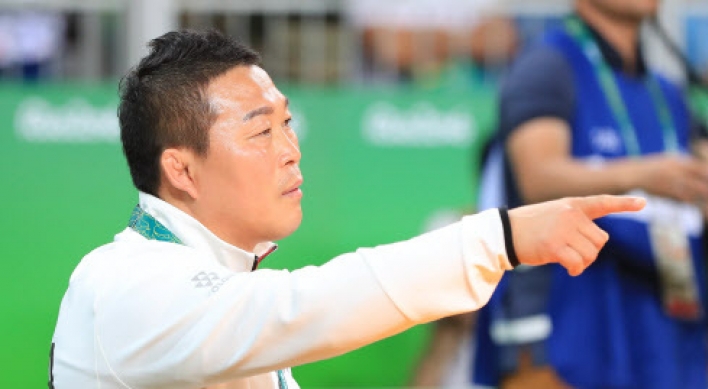 Banned Korean wrestling coach permitted back in seat