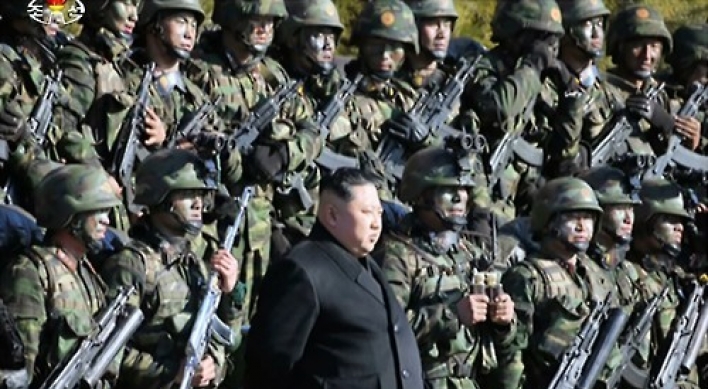 N. Korean leader using group photos to show off his hold on power: observers